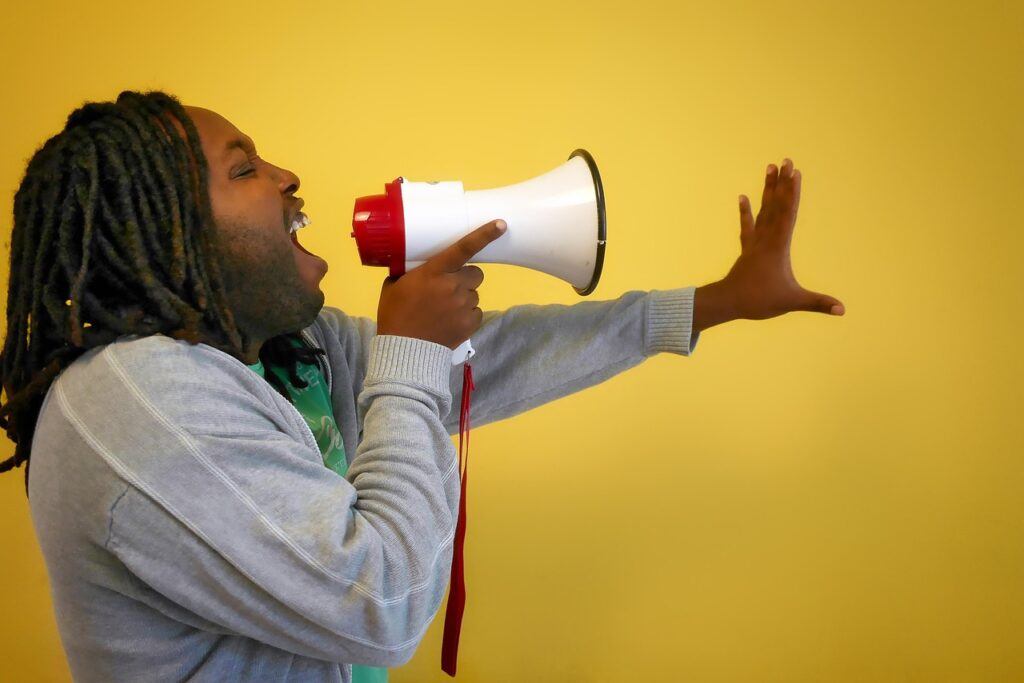 Call to Action by shouting through a loud hailer